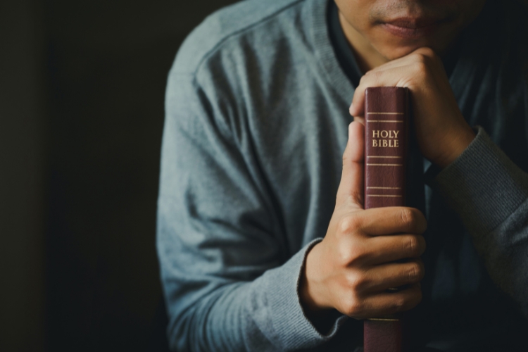 man holding bible