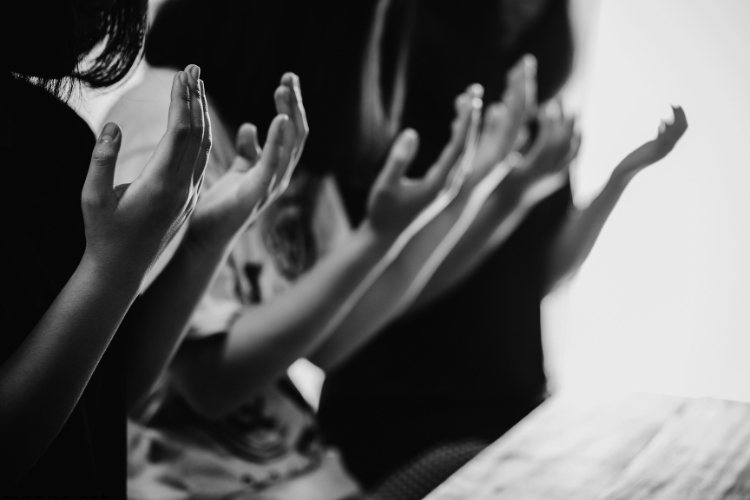 people keeping hands for prayer